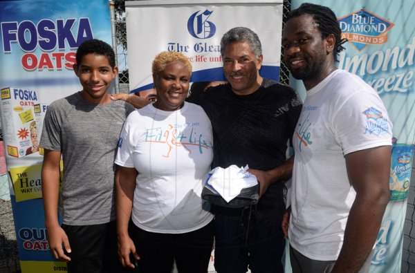 Lionel Rookwood/Photographer

The Gleaner's Anastasia Cunningham and Marvin Gordon (right) with third-place Zachary Spence and second-place Julian Spence after the weights challenge for men at The Gleaner's Fit 4 Life and St Matthew's Walkers event on Saturday, October 7, 2017 at the Jacks Hill Community Centre in St Andrew.