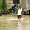 Ricardo Makyn/Staff Photographer.
 A child wades through a flooded yard







Walks Road  in Spanish Town that was flooded  on Wednesday 29.9.2010.