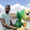 Gladstone Taylor / Photographer

Rohan Cummings (left) accepts his prize from Deandrea Matherson (Promotion Supervisor, Chas Ramson) for first place in the diaper changing competition
the shoppers fair food month promotion in Harbour View on saturday