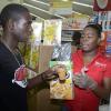 Gladstone Taylor / Photographer

Angelo Bryan Tries a sample of nestle cereal offered by Akiellia Dwyer (right) As seen at the shoppers fair food month promotion in Harbour View on saturday