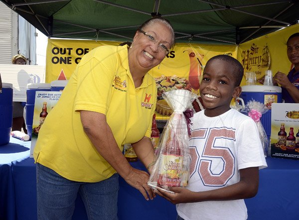 Gladstone Taylor / Photographer

Kevuen Hewitt (right) holds his balance to the end, winning the newspaper dance competition over Myrtle Markland.

Newspaper dance competition as seen at the shoppers fair food month promotion in Harbour View on saturday