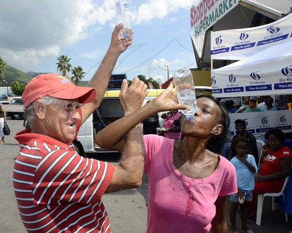 Gladstone Taylor / Photographer

Nicola Shervington (right) and Christopher Quallo both drank their way to victory in the water drinking competition as seen at the shoppers fair food month promotion in Harbour View on saturday