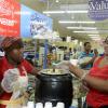 Gladstone Taylor / Photographer

Rhonda Sutherland hands a sample of nestle cornmeal porridge prepared with condensed milk and evaporated milk to Sharon Dookie (right) as seen at the Gleaner company food moth promotion held at shoppers fair super market on brunswick avenue, spanish town on saturday