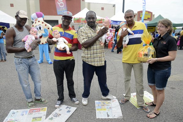 Gladstone Taylor / Photographer

l-r Will Herrera, Courtney Mullings, Omar Wilson, Francois Hussey and  Kathryn Silvera (advertising & marketing / Chas & Ramson) moments before declaring a winner of the baby daiper changing conest as seen at the Gleaner company food moth promotion held at shoppers fair super market on brunswick avenue, spanish town on saturday