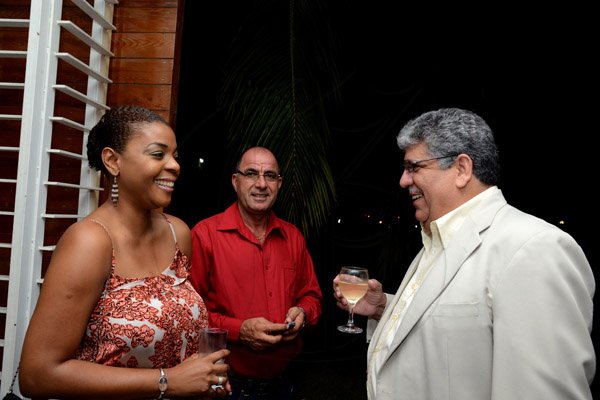 Winston Sill/Freelance Photographer
French Ambassador Ginette de Matha host Reception and Handing over of the  insignia of French National Order of Merit to Etienne Andre`, held at Hillcrest Avenue on Friday night March 14, 2014. Here are Saleema Barclay (left); Abdul Khan (centre); and Bobby Hunter (right).