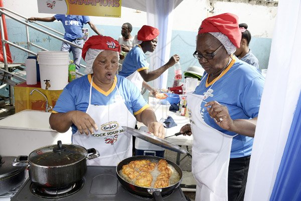 Gladstone Taylor / Photographer

Evelyn Allen (left) and highest scoring individual in the preliminary rounds Jacqulin Pantry from team Grace overlooks their cheese pasta stuffed chicken breast.