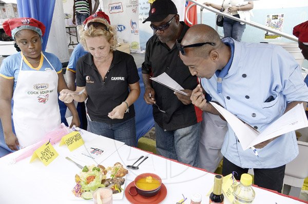 Gladstone Taylor / Photographer

From left: The Grace Kenndy Representative Iota Rhoden of Team Grace looks on as judges Alessandra Bartolini, Jason Gentles and Gariel Ferguson sample their meal at the gas pro street style cook up held on tower street last week saturday.