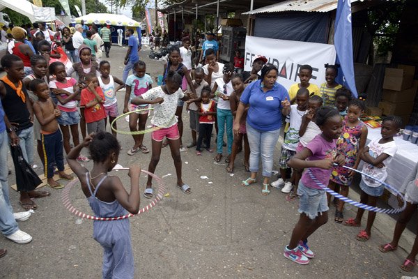 Gladstone Taylor / Photographer

children of the surrounding community playing in the street at the gas pro street style cook up held on tower street held last week saturday.
