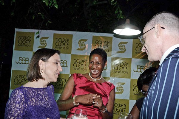 Winston Sill/Freelance Photographer
JAAA/Scotiabank Group presents the Golden Cleats Awards 2014 Ceremony, held at Terra Nova All-Suite Hotel, Waterloo Road on Friday night December 12, 2014.  Here are Julia Sutherland (left), Deputy British High Commissioner; Deon Hemmings-McCatty (centre); and Dr. Duncan Sutherland (right).