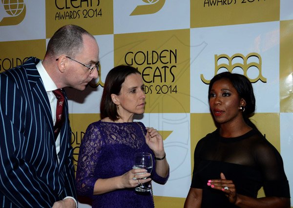 Winston Sill/Freelance Photographer
JAAA/Scotiabank Group presents the Golden Cleats Awards 2014 Ceremony, held at Terra Nova All-Suite Hotel, Waterloo Road on Friday night December 12, 2014. Here are Dr. Duncan Sutherland (left); Julia Sutherland (centre), Deputy British High Commissioner; and Shelly-Ann Fraser-Pryce (right).