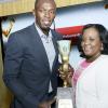 Rudolph Brown/Photographer
Natalie Neita-Headley, Minister of State in the Ministry of Sports presents award to Olympian Usain Bolt, Male athlete of the year at the Scotiabank Golden Cleats Awards Luncheon at Venetian Suite, Terra Nova Hotel on Tuesday, January 8, 2013.