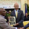 Rudolph Brown/Photographer
Governor General Sir Patrick Allen (centre) presents Robert Allen a Jamaica 50th Jubilee Award of Excellence while the honouree receives congratulations from Custos of St Catherine Rev Sophia Azan. Governor General's Achievemnet Awards at Kings House on Tuesday, November 13, 2012