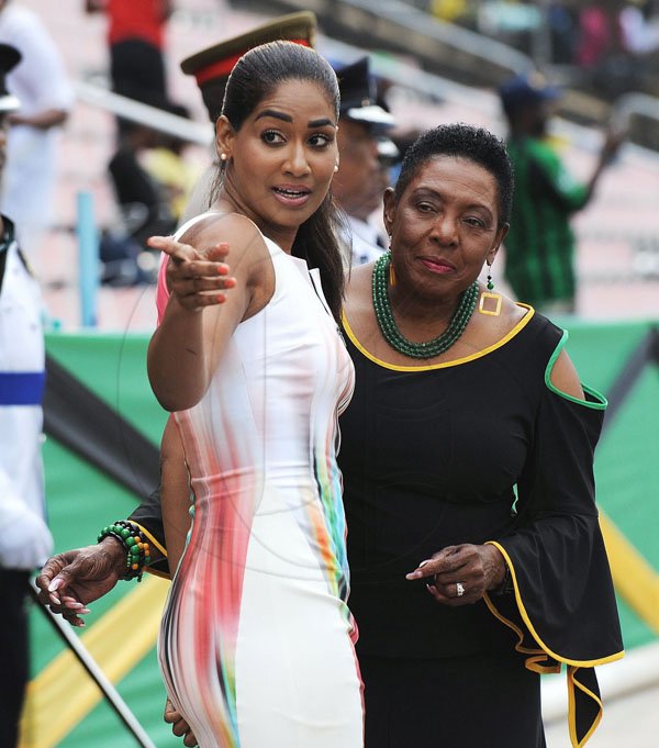 Ian Allen/Photographer<\n>Grand Gala 2017. *** Local Caption *** @Normal: Something interesting caught the eyes of culture minister Olivia 'Babsy' Grange (right), and Lisa Hanna, the opposition spokesperson on culture, at Grand Gala 2017 at the National Arena on Sunday.