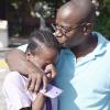 Jermaine Barnaby/Photographer<\n>Karl Francis (right) tries to console his daughter Shennel Francis after who burst into tears after her learnt that she  was awarded to go Cedar Grove High school in Portmore during the announcement of the GSAT results on Wednesday June 17, 2015. Francis scored 98, 91 and 92.