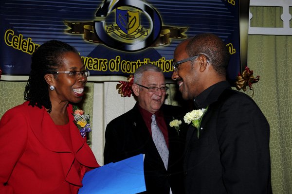 Winston Sill / Freelance Photographer
Holy Childhood High School (HCHS) Long Service Awards Ceremony, held at Knutsford Court Hotel, Ruthven Road on Tuesday night December 18, 2012. Here are Elaine Foster-Allen (left), PS, Ministry of Education; Minister Ronald Thwaites (centre); and Fr. Donald Chambers (right), Chairman, Board of Management, HCHS.