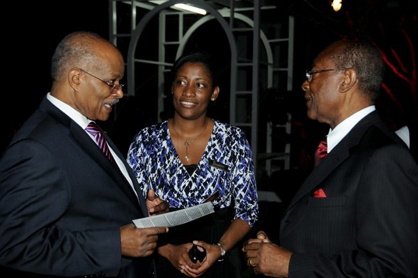 Winston Sill / Freelance Photographer
Launch of Dr. Henry Lowe Autobiography titled "It Can Be Done", held at Eden Gardens, Lady Musgrave Road on Wednesday night November 28, 2012. Here are Sir Kenneth Hall (left);  Tanikie McClarthy (centre); and Dr. Lowe (right).