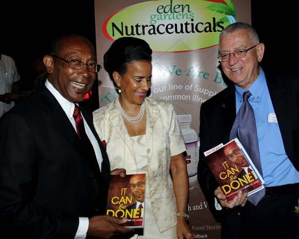 Winston Sill / Freelance Photographer
Launch of Dr. Henry Lowe Autobiography titled "It Can Be Done", held at Eden Gardens, Lady Musgrave Road on Wednesday night November 28, 2012. Here are Dr. Lowe (left), Chairman, Environmental Health Foundation; Janet Lowe (centre); and Ronald Thwaites (right), Minister of Education.