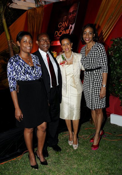 Winston Sill / Freelance Photographer
Launch of Dr. Henry Lowe Autobiography titled "It Can Be Done", held at Eden Gardens, Lady Musgrave Road on Wednesday night November 28, 2012. Here are Tanikie McClarthy (left), Deputy CEO, Environmental Health Foundation; Dr. Lowe (second left), Chairman, Environmental Health Foundation; Janet Lowe (second right); and Novlet Deans (right), CEO, Environmental Health Foundation.
