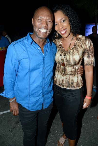 Rudolph Brown/Photographer
Suzette Shaw-Reid poe with Hugh Meredith  at the IAJ Christmas in November party held at the Guardian Life car park in New Kingston on Saturday, November 16, 2013.