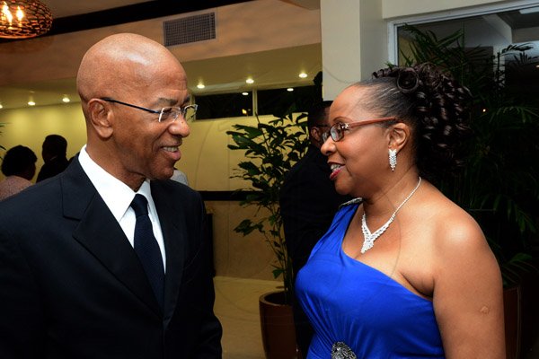 Winston Sill/Freelance Photographer
The Institute of Chartered Accountants of Jamaica (ICAJ) Annual Awards Banquet, for the presentation of ICAJ Distinguished MemberAward to Eric A. Crawford; and the Launch of 50th Anniversary Celebrations, held at the Jamaica Pegasus Hotelm New Kingston on Thursday night December 4, 2014.  Here are Milverton Reynolds (left); and Rosemarie Heaven (right), Executive Director, ICAJ.