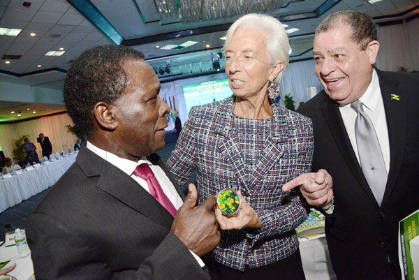 Rudolph Brown/ Photographer<\n>bUSINESS dESK<\n>Christine Lagarde, IMF Managing Director chat with Audley Shaw, (right) Finance Minister and Keith Mitchell, (left) prime minister of Grenada at the opening Ceremony of IMF High Level Caribbean Forum on Thursday, November 16, 2017 *** Local Caption *** @Normal:Christine Lagarde, International Monetary Fund managing director, is certainly the centre of attention here as she raps with Grenada’s Prime Minister Keith Mitchell (left) and Audley Shaw, Jamaica’s finance and public service minister, at the opening ceremony of the Fund’s High-Level Caribbean Forum on Thursday, November 16 at the Jamaica Pegasus hotel, New Kingston.