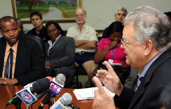 Rudolph Brown/Photographer
Hon. Karl Samuda, (right) Ministry of Industry, Investment and Commerce, speaks to members of the media during a press conference to address issues relating to cement and rice supplies and other matters at the Ministry of Industry, 4 St. Lucia Ave in New Kingston on Wednesday, March 17-2010
