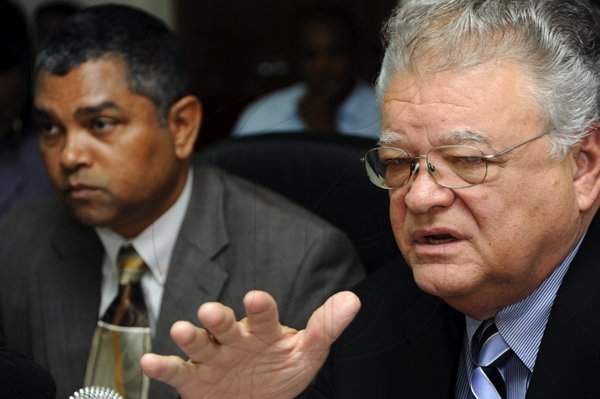 Rudolph Brown/Photographer
Hon. Karl Samuda, (right) Ministry of Industry, Investment and Commerce, and Michael Stern, State Minister of Industry, Investment and Commerce speaks to members of the media during a press conference to address issues relating to cement and rice supplies and other matters at the Ministry of Industry, 4 St. Lucia Ave in New Kingston on Wednesday, March 17-2010
