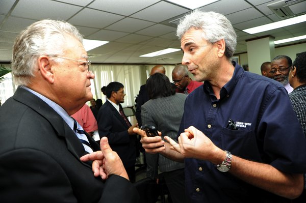 Rudolph Brown/Photographer
Hon. Karl Samuda, (left) Ministry of Industry, Investment and Commerce, in discussion with Chris Bicknell, Group CEO and Financial Manager of Tank-Weld. at press conference to address issues relating to cement and rice supplies and other matters at the Ministry of Industry, 4 St. Lucia Ave in New Kingston on Wednesday, March 17-2010