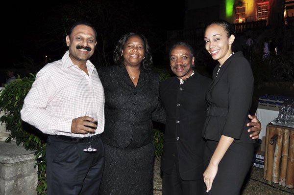 Janet Silvera Photo
 
From L- KS Kumar, Sutherland Global Services, attorney Nadine Amos, chairman of JAMPRO, Milton Samuda, and attorney Greenaway at the final night function of the Jamaica Investment Forum at the Rose Hall Great House last Thursday night in Montego Bay.