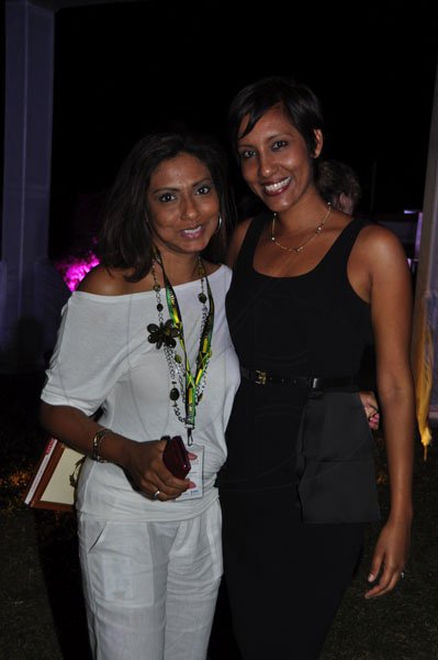 Janet Silvera Photo
 
Event Planners, Nicole Pandohie (left) and Nasma Chin at the final night function of the Jamaica Investment Forum at the Rose Hall Great House last Thursday night in Montego Bay.
