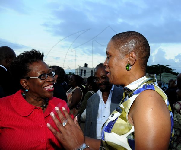 Winston Sill / Freelance Photographer
Island Special Constabulary Force (ISCF) Change of Command Parade for new Commandant James Golding, held at the ISCF Headquarters, Herman Barracks on Saturday October 6, 2012. Here are DPP, Paula Llewellyn (left); and Dr. Iva Gloudon (right), Trinidad and Tobago High Commissioner.