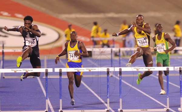 Ricardo Makyn/Staff Photographer
Left Jamaica Colleges Javarn Gallimore battles with Manchester High's Omar McLeod in the Boys open 400 Meters Hurdles Final Gallimore won the event  at the Boys and Girls Championships at the National Stadium on Friday 30.3.2012