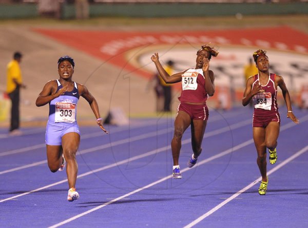 Ricardo Makyn/Staff Photographer
Left Christania Williams of Edwin Allen winning the  Girls  Class 2,100 Final at the Boys and Girls Championships at the National Stadium on Friday 30.3.2012