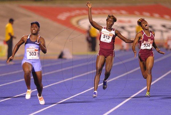 Ricardo Makyn/Staff Photographer
Left Christania Williams of Edwin Allen winning the  Girls  Class 2,100 Final at the Boys and Girls Championships at the National Stadium on Friday 30.3.2012
