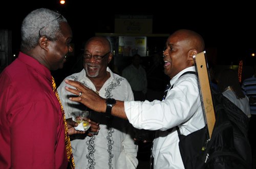 Winston Sill/Freelance Photographer
Garfield Lettman (left) and Maurice Foster are getting jokes from the comedic Mark Carter, who not only had his Jamaica College suit down pat, he even brought along his T-square.

Wray and Nephew Skoolaz party held at the Visitor's Lodge on Wednesday December 7, 2011.