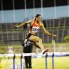 Ricardo Makyn/Staff Photographer
Kaliese Spencer clears the hurdle on her way to an easy victory in the women's 400 metres final, at the Jamaica Athletics Administrative Association/Supreme Ventures Limited National Senior Championships, at the National Stadium last night. Spencer won in 54.15 seconds.