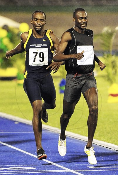 Ian Allen/Photographer
Aldwyn Sappleton (right) winning the men's 800 metres in 1:49.07 ahead of University of Technology's Ricardo Cunningham (1:49.19) on Saturday's third day of the JAAA/Supreme Ventures Limited National Senior Championships at the National Stadium.