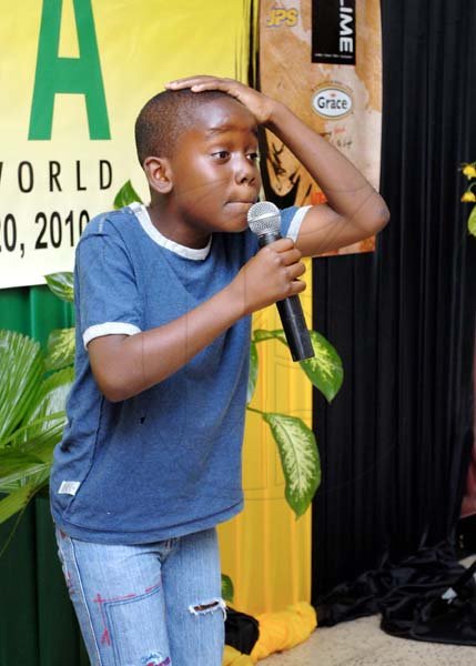 Gavin McKenzie entertains with speech item, ?No se yu gone? at the launch of Expo Jamaica 2010.
