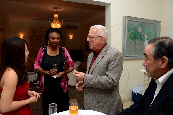 Winston Sill/Freelance Photographer
Outgoing Japanese Ambassador Yasuo Takase, his wife Sayoko Takase and daughter Yuria Takase host a Reception and Dinner for some of their close and special jamaican friends, held at Seaview Avenue on Friday night March 20, 2015. Here are Yuria Takase (left); Marcia Thwaites  (second left); Ronald Thwaites (second right), Minister of Education; and Ambassador Yasuo Takase (right).