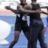 Ian Allen/Photographer
Jamaica College's Alec-Verne Longmore (left), winner of the Class Two boys' shot put, celebrates his triumph with a team-mate at the National Stadium. Longmore had a winning throw of 15.45 metres.