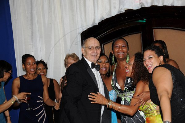 Winston Sill/Freelance Photographer
The Jamaica Chamber of Commerce (JCC) Civic Affairs Committee present its annual Grand Charity Ball, under the theme "Dream the Possible  Dream", held at the Jamaica Pegasus Hotel, New Kingston on Saturday night November 2, 2013. Here Sameer Younis seems to having a good time with   members of  the Civic Affairs Committee.
