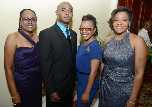 Rudolph Brown/Photographer
From left are Vera Lindo, Charles Tam, Tanya Brown and Joy Goulbourne at the JCCUL 72nd anniversary Dinner and awards Banquet at the Ritz Carlton on Saturday, May 17, 2013
