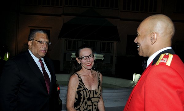 Winston Sill / Freelance Photographer
Major General Antony Anderson, Chief of Defence Staff host Cocktail Party,held at the Flagstall Officers' Mess, Up Park Camp on Saturday night December 1, 2012. Here are Minister Dr. Peter Phillips (left); Sandra Phillips (centre); and Major Gen. Anderson (right).
