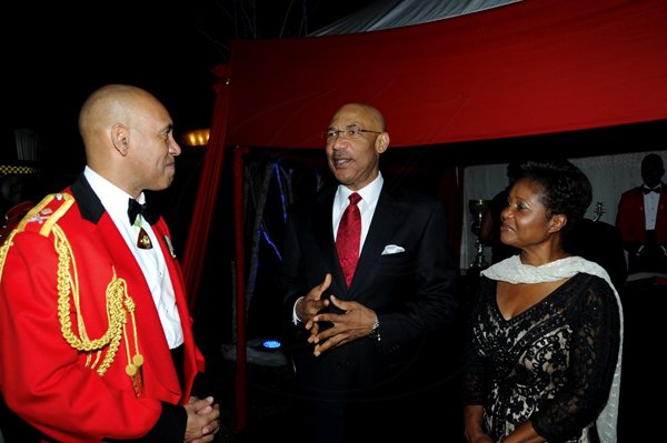 Winston Sill / Freelance Photographer
Major General Antony Anderson, Chief of Defence Staff host Cocktail Party,held at the Flagstall Officers' Mess, Up Park Camp on Saturday night December 1, 2012. Here are Major Gen. Anderson (left); Governor General Sir Patrick Allen (centre); and Lady Patricia Allen (right).