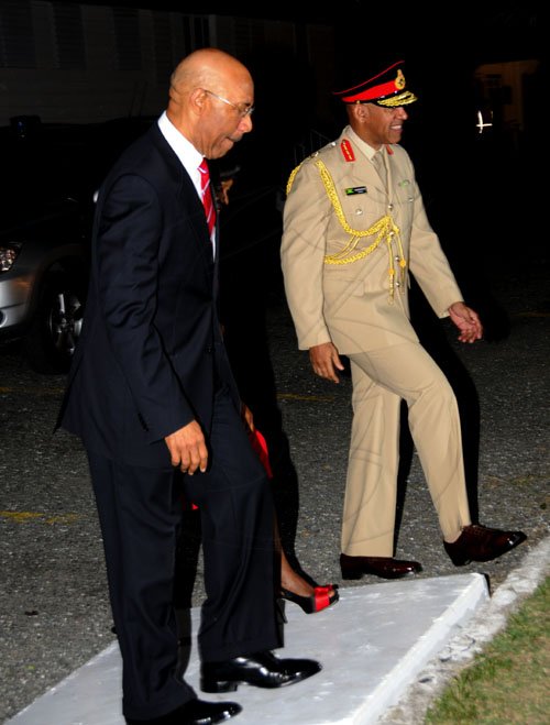 Winston Sill / Freelance Photographer
The Jamaica Defence Force (JDF) annual Open Air Carol Service 2011, held at Up park Camp on Tuesday night December 13, 2011. Here Governor General Sir Patrick Allen and Lady Allen arrive for the service; at right is Major General Antony Anderson Chief of Defence Staff, JDF.