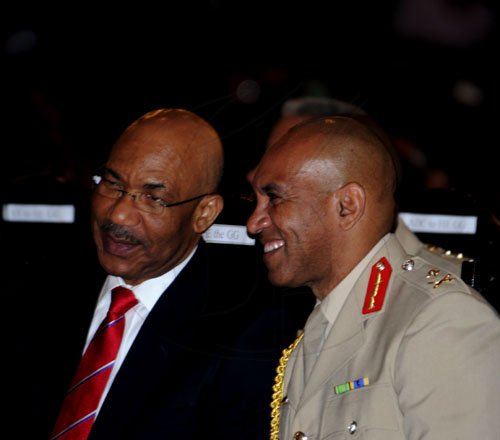 Winston Sill / Freelance Photographer
The Jamaica Defence Force (JDF) annual Open Air Carol Service 2011, held at Up park Camp on Tuesday night December 13, 2011.Here are Governor General Sir Patrick Allen (left); and Major General Antony Anderson (right), Chief of Defence Staff, JDF.