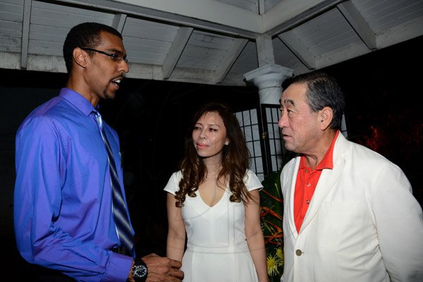 Winston Siill/Freelance Photographer
Japanese Ambassador Yasuo Takase and his wife Sayoko Takase host Send-Off Reception and Dinner for JET Representatives, held at Seaview Avenue, St. Andrew on Friday night June 27, 2014. Here are Marc Mundy (left), JET Representative; Sayoko Takase (centre); and Ambassador Takase (right).