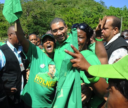 Ian Allen/Photographer
Prime Minister Andrew Holness being greeted by supporters during his tour of Manchester on Wednesday.