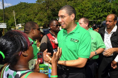 Ian Allen/ Photographer
Prime minister Andrew Holness greets supporters in Witney Turn in Manchester, as he toured the parish yesterday.