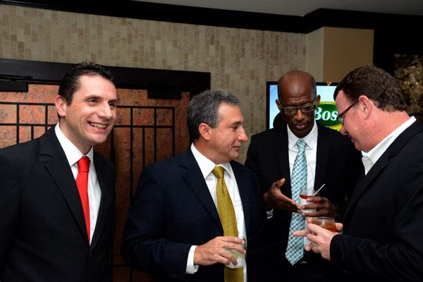 Winston Sill/Freelance Photographer
The Jamaica Manufacturers' Association Limited (JMA) in association with Digicel host the 46th Annual Awards Banquet, held at the Jamaica Pegasus Hotel, New Kingston on Thursday night October 9, 2014. Here are Jason Corrigan (left), of Digicel; Metry Seaga (centre), Deputy President, JMA; Clement "Jimmy Lawrence (second right), Managing Director, Wray Nephew Limited; and Paul Henriques (right).